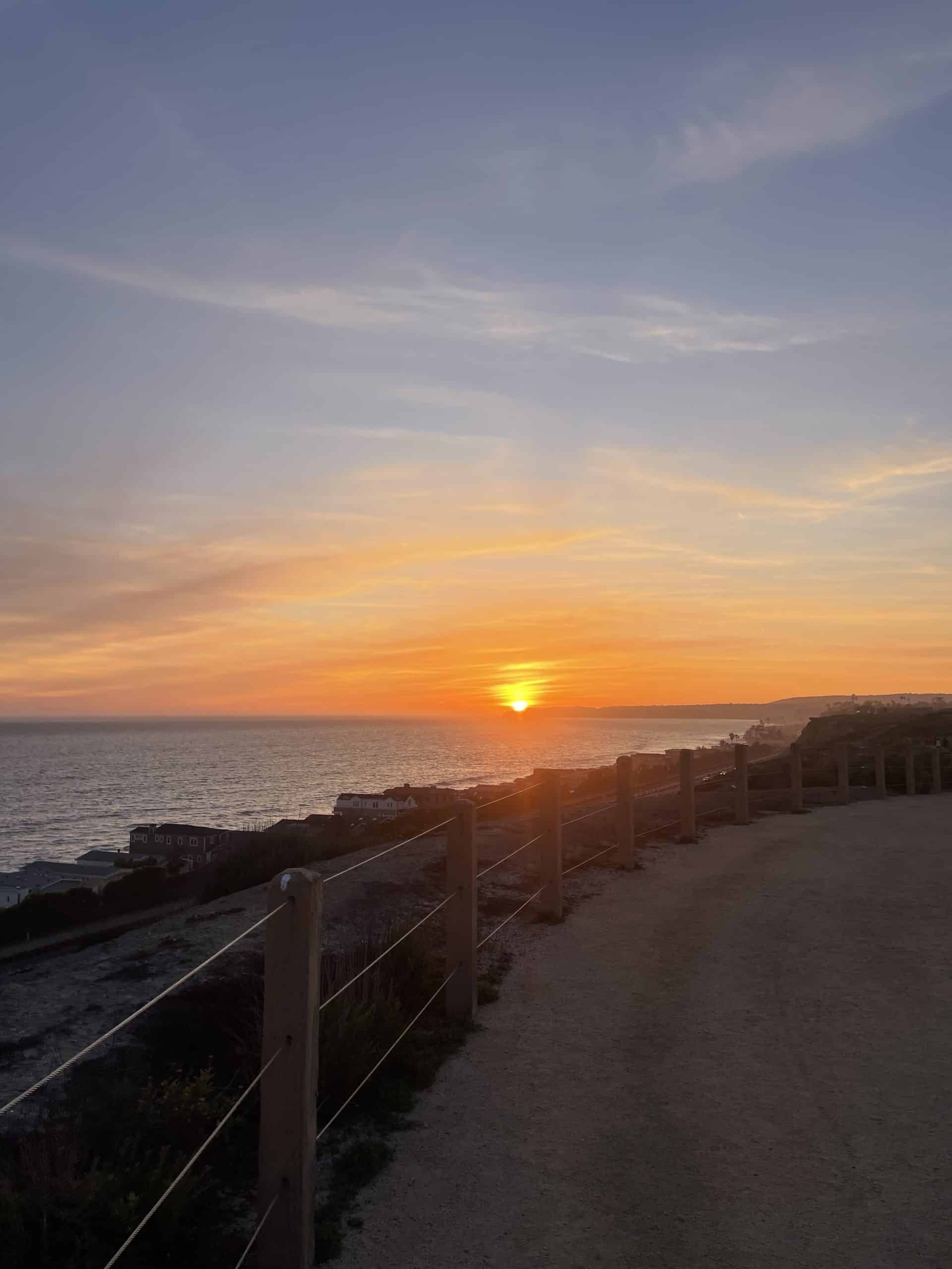 sunset on a trail looking towards the ocean in san Clemente 