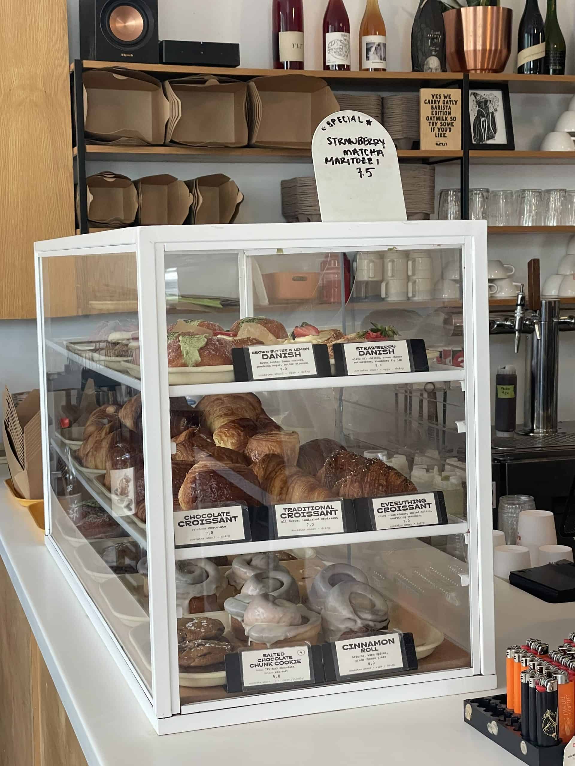 baked good case with croissants at Bandit Coffee